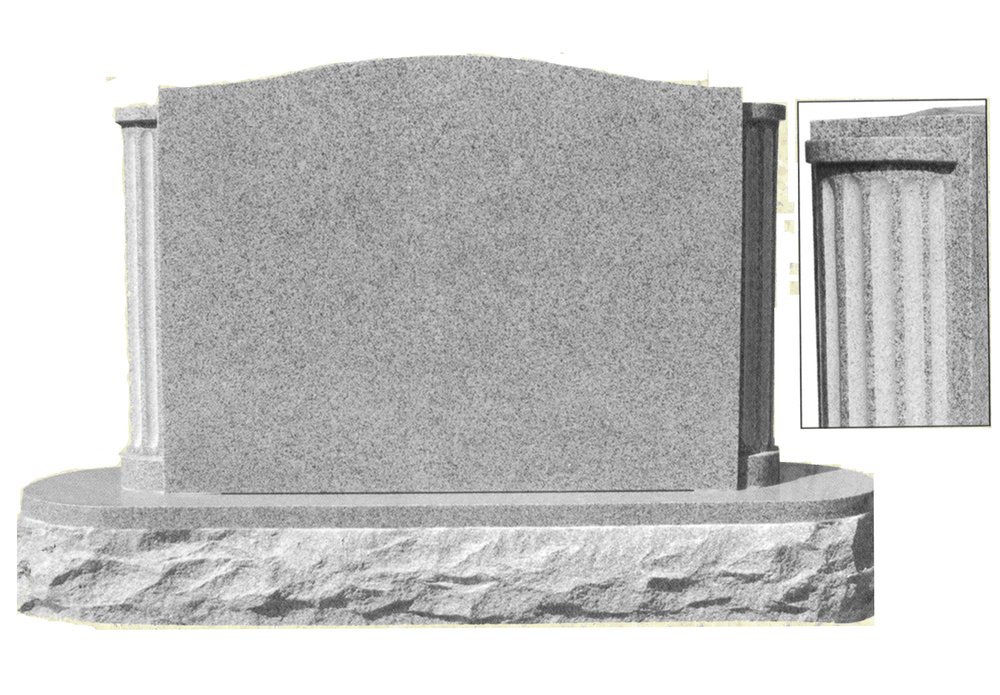Grey granite monument with fluted columns either side and a rock pitched base, with an inset close up of the column carving